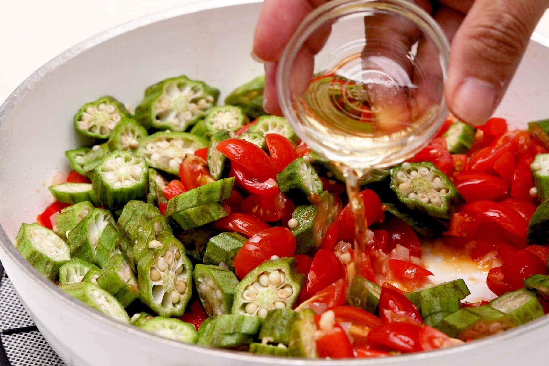 Adding vinegar.