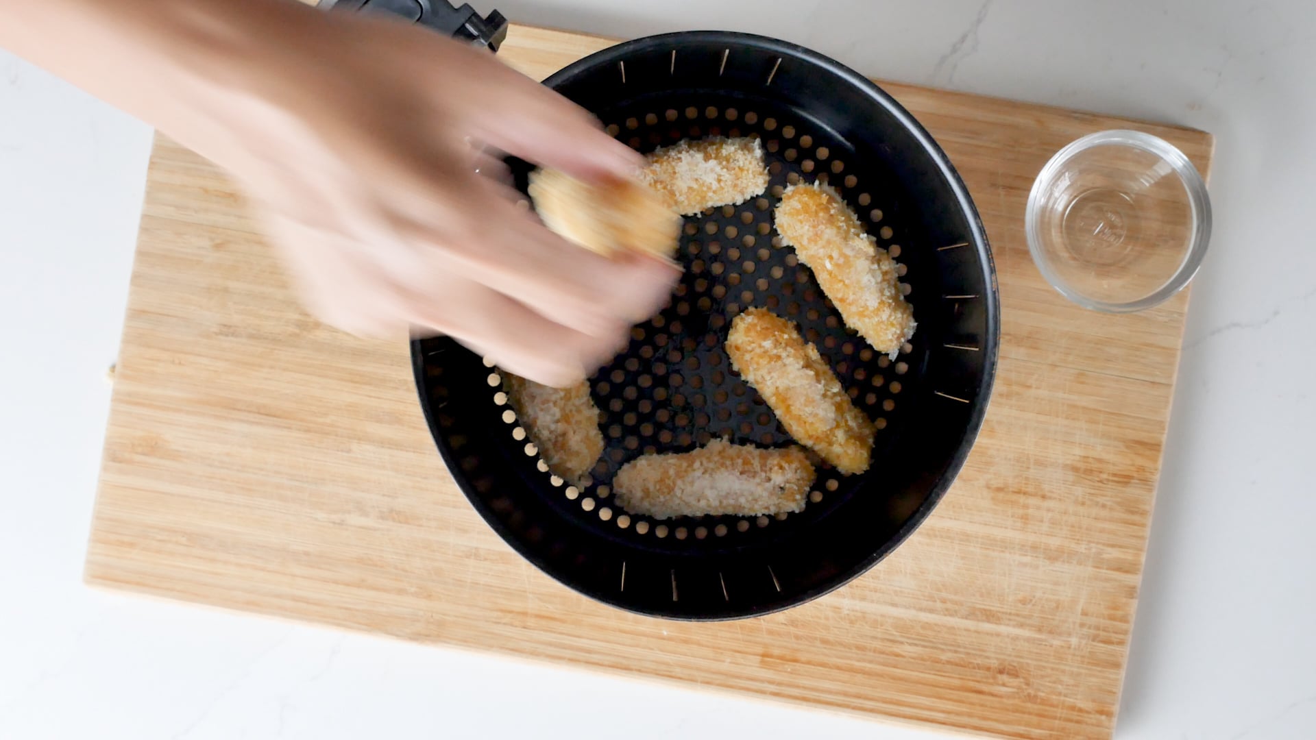 Putting in the air fryer tray