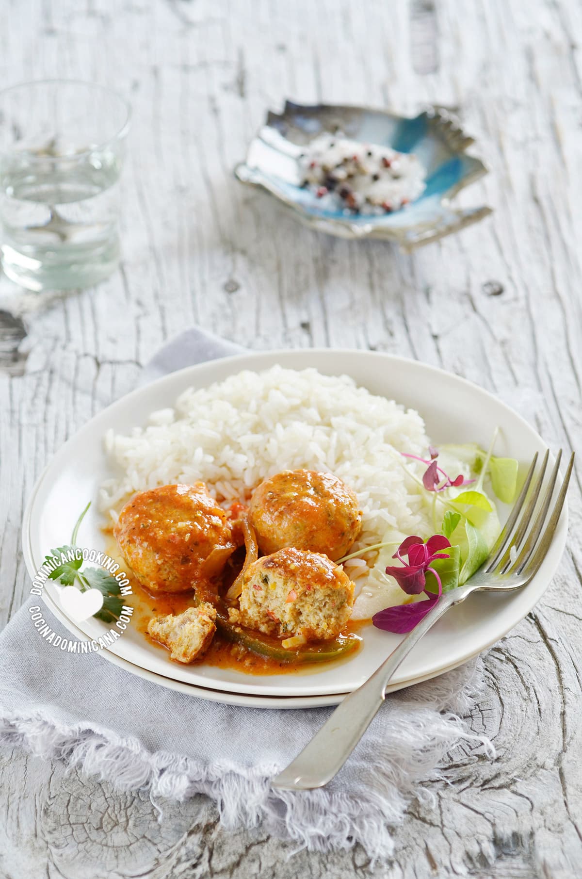 Fishballs in tomate sauce serving with rice.