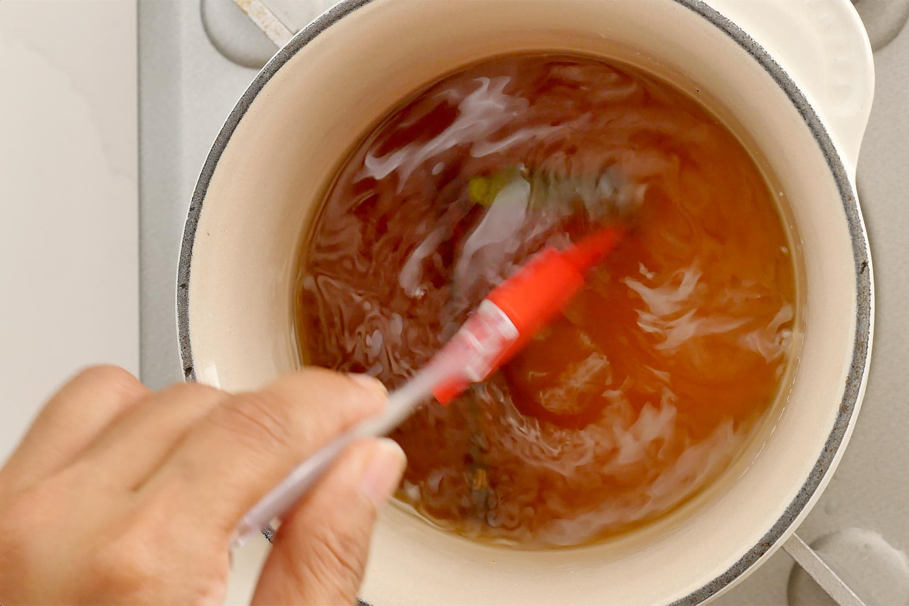 Stirring syrup in the pot