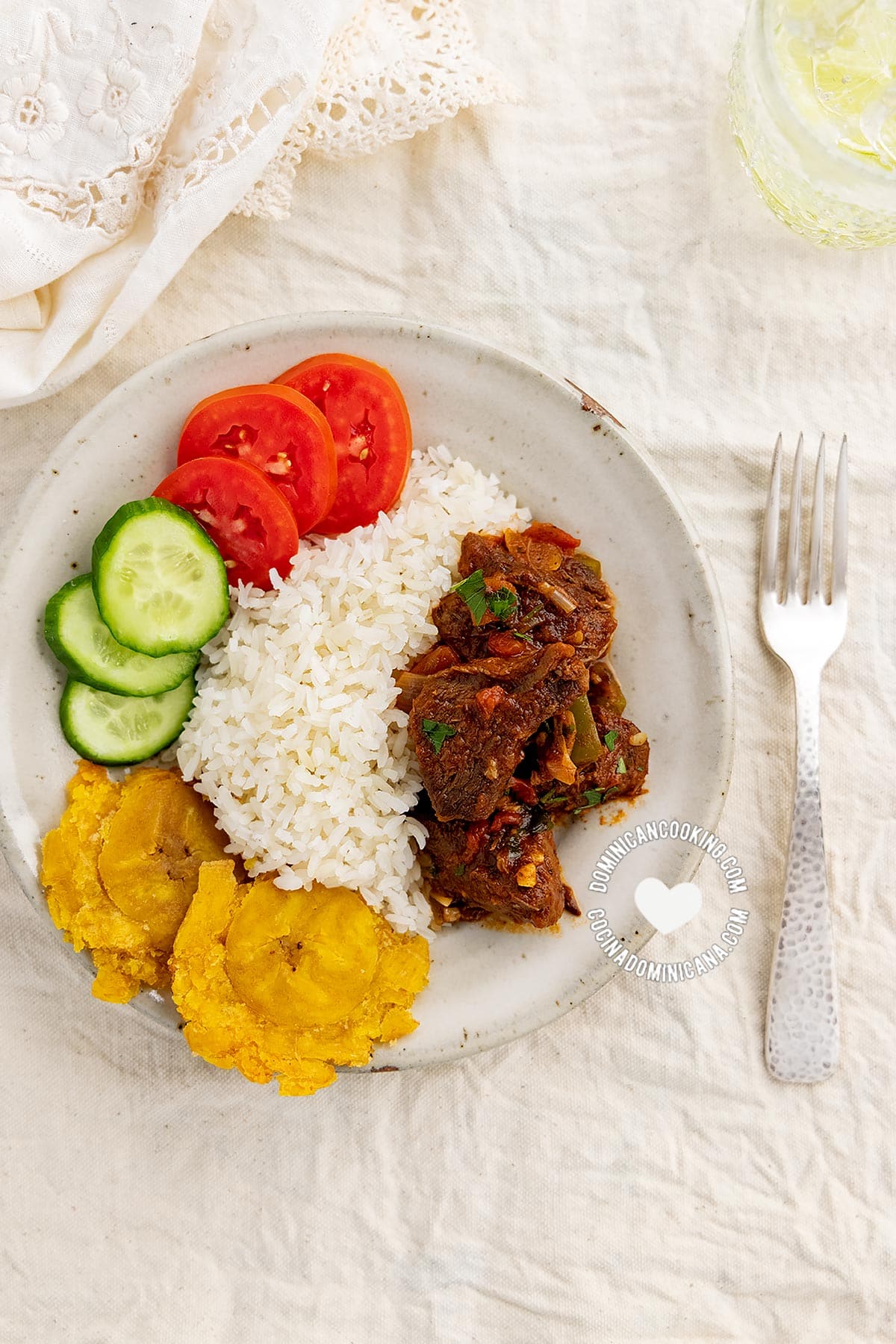 Carne de res guisada (dominican braised beef) served with to rice, tostones, and salad.