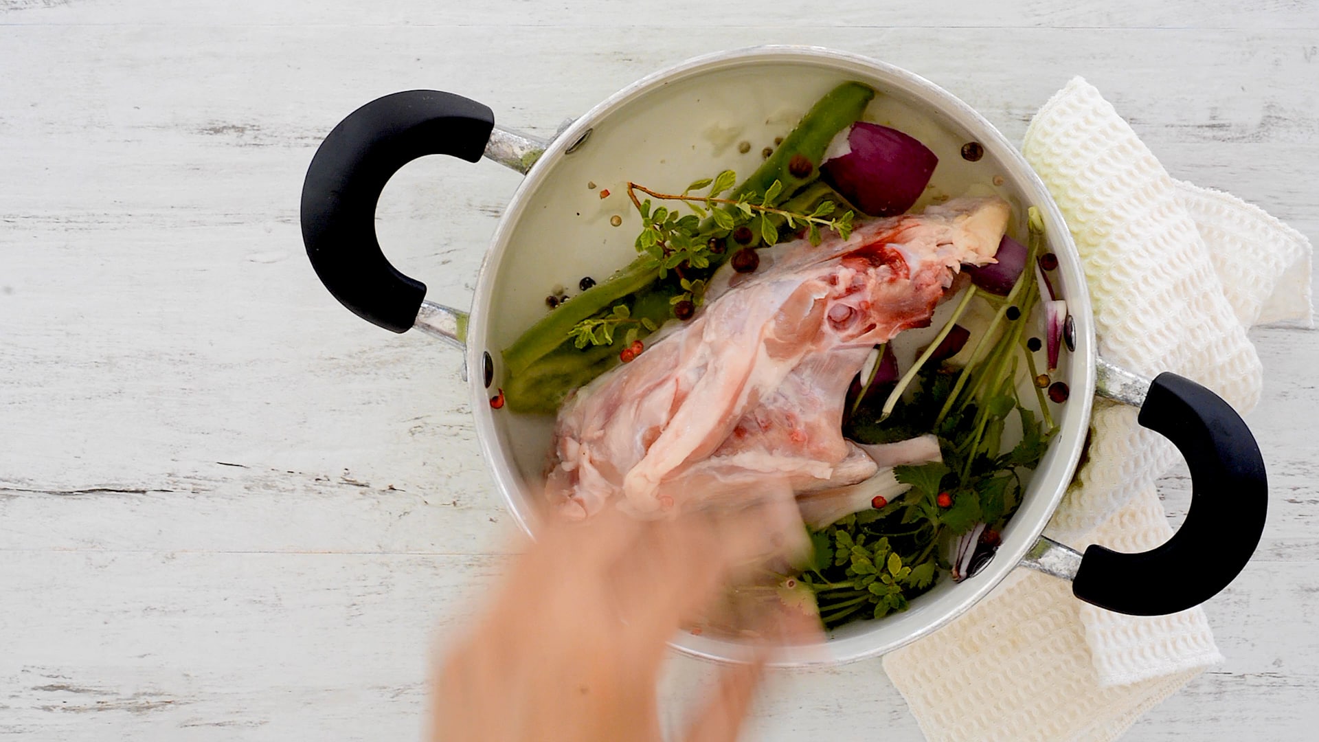 Placing chicken in the pot