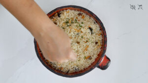Sprinkling parsley on rice