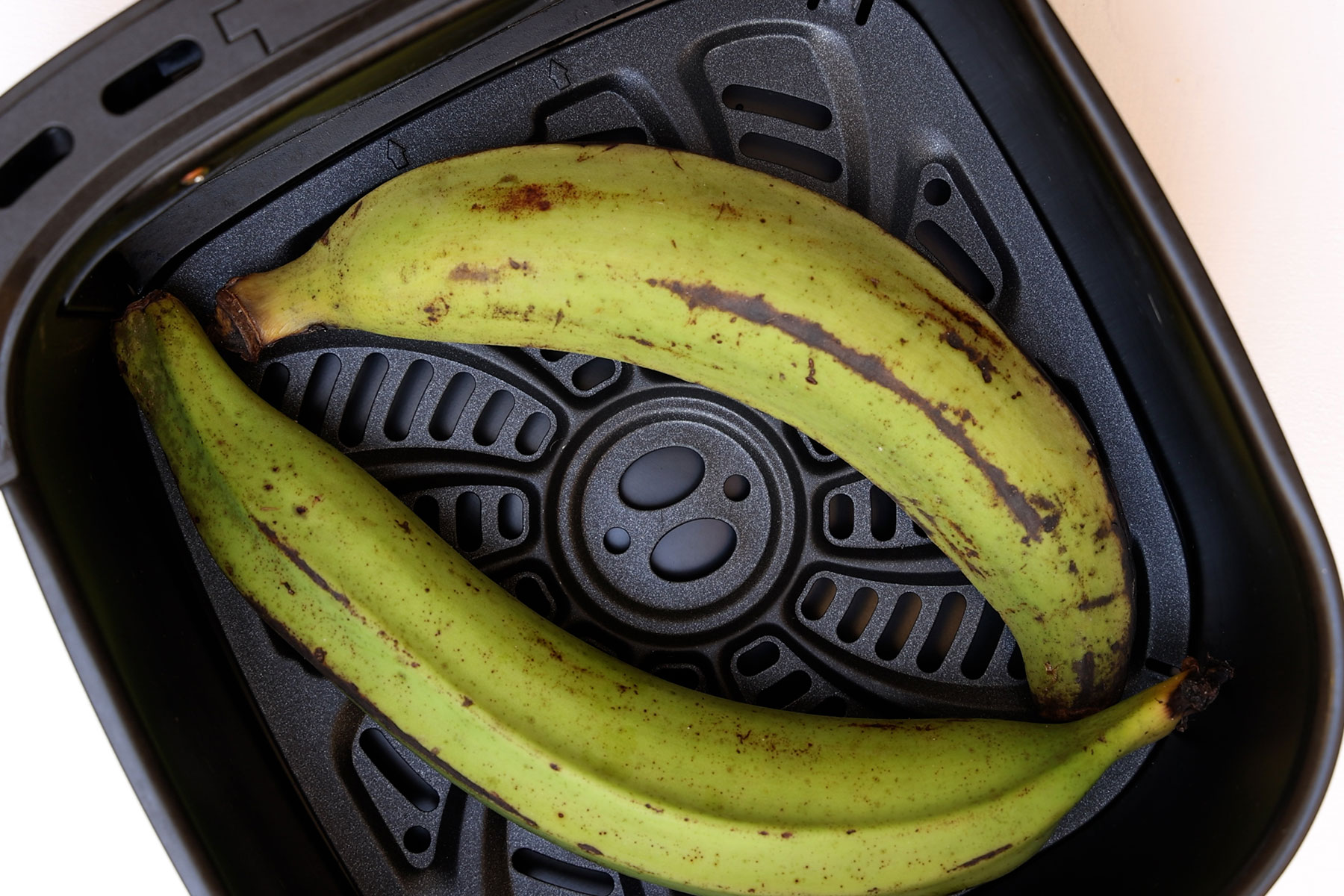 Air frying plantains.