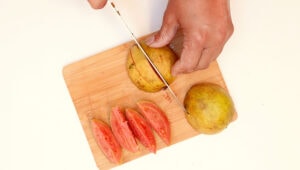 Chopping guava.