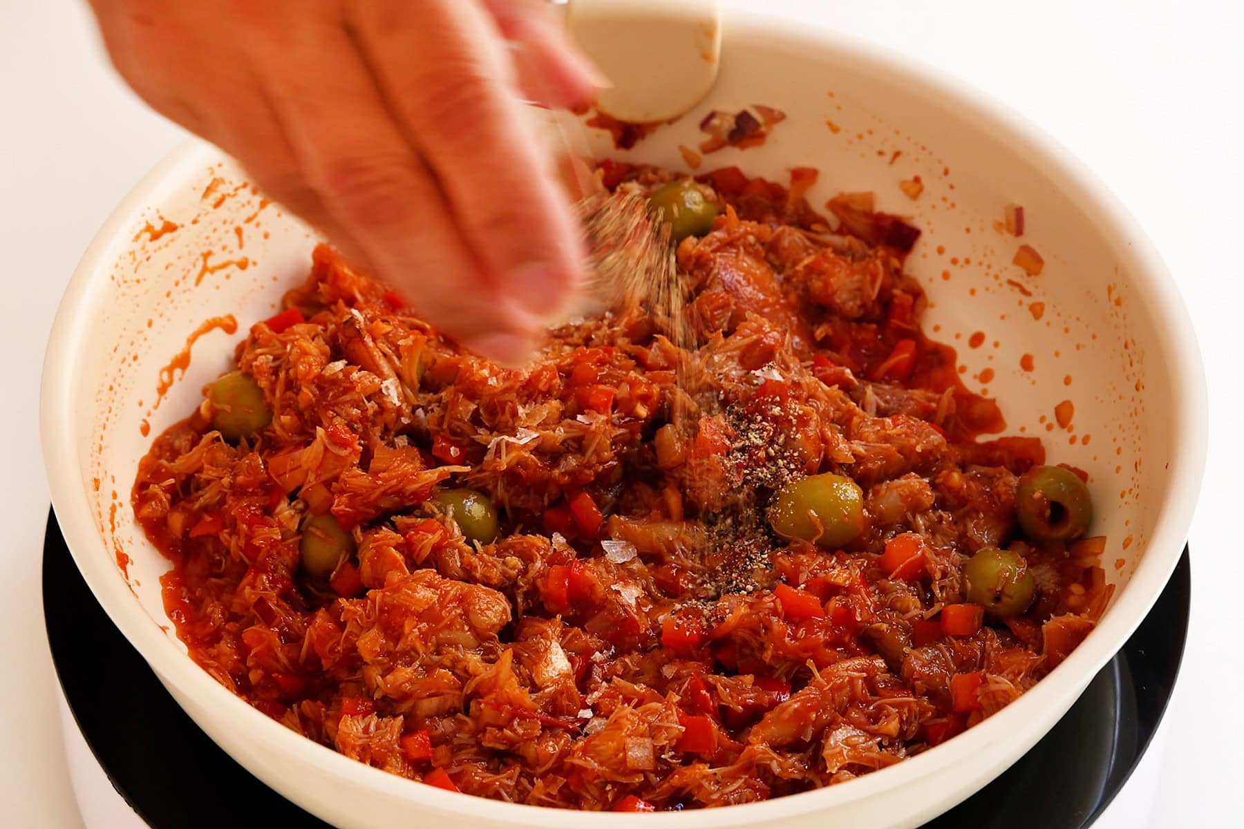 Seasoning crabmeat.