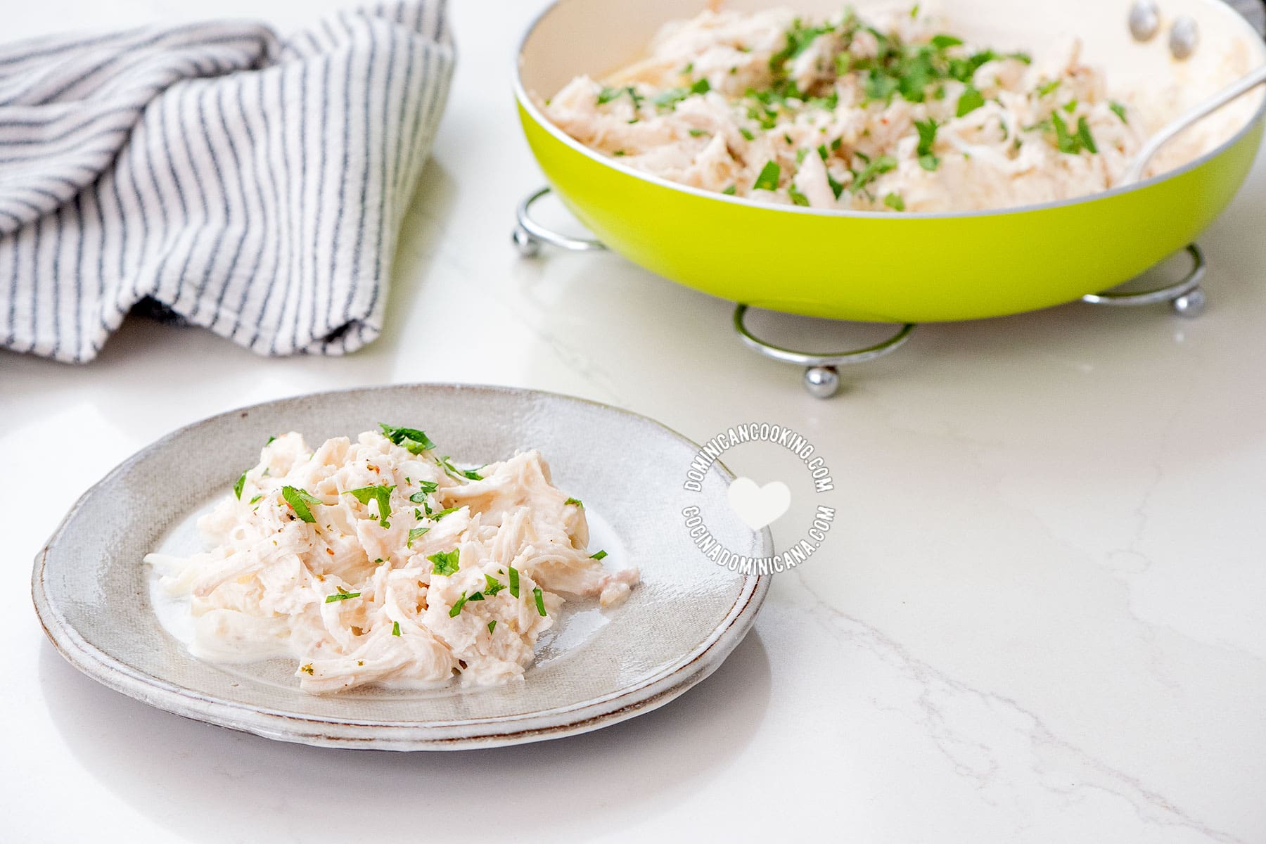 Creamy chicken on plate and in a pan