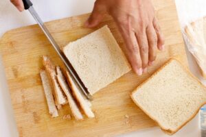 Cutting crust of bread.