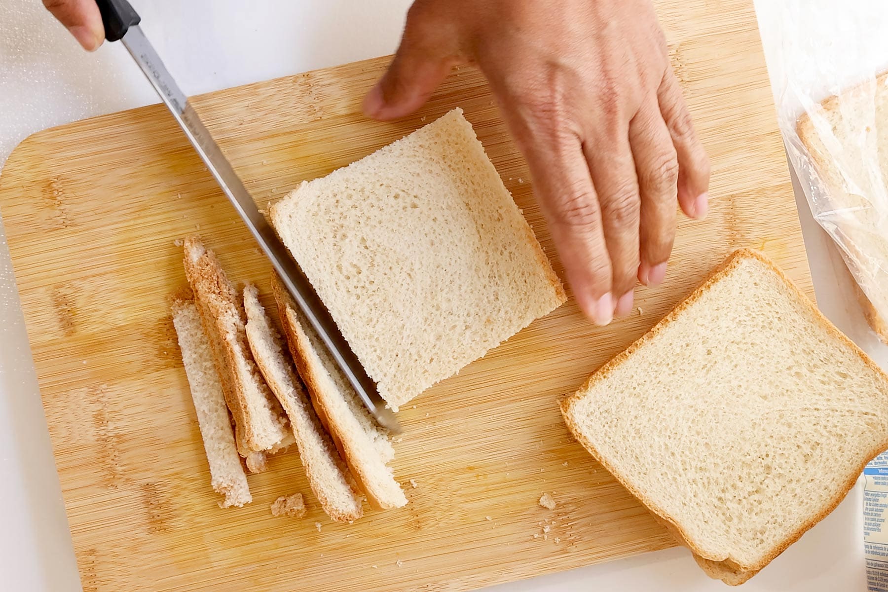 Cutting crust of bread.