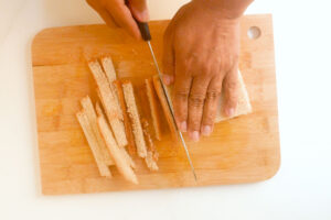 Cutting bread crust.