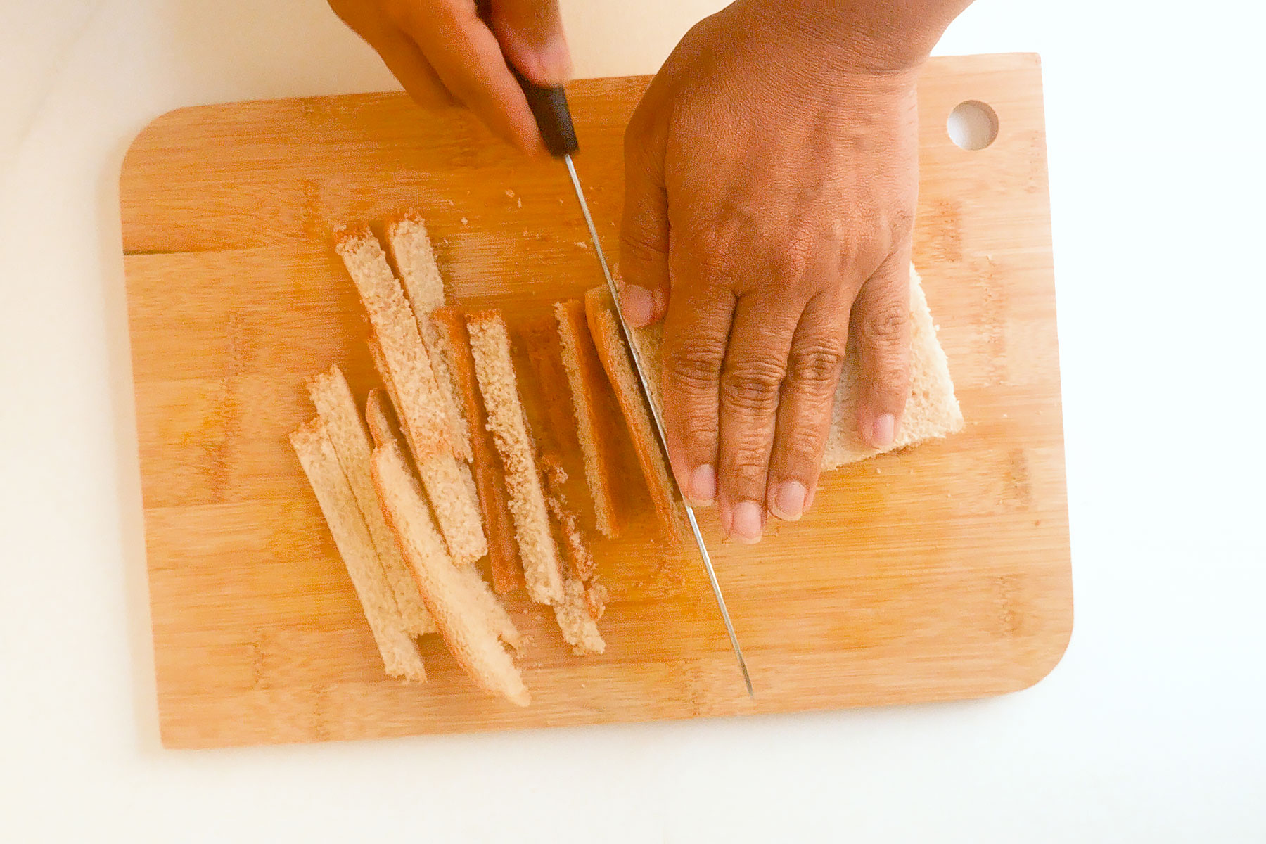 Cutting bread crust.