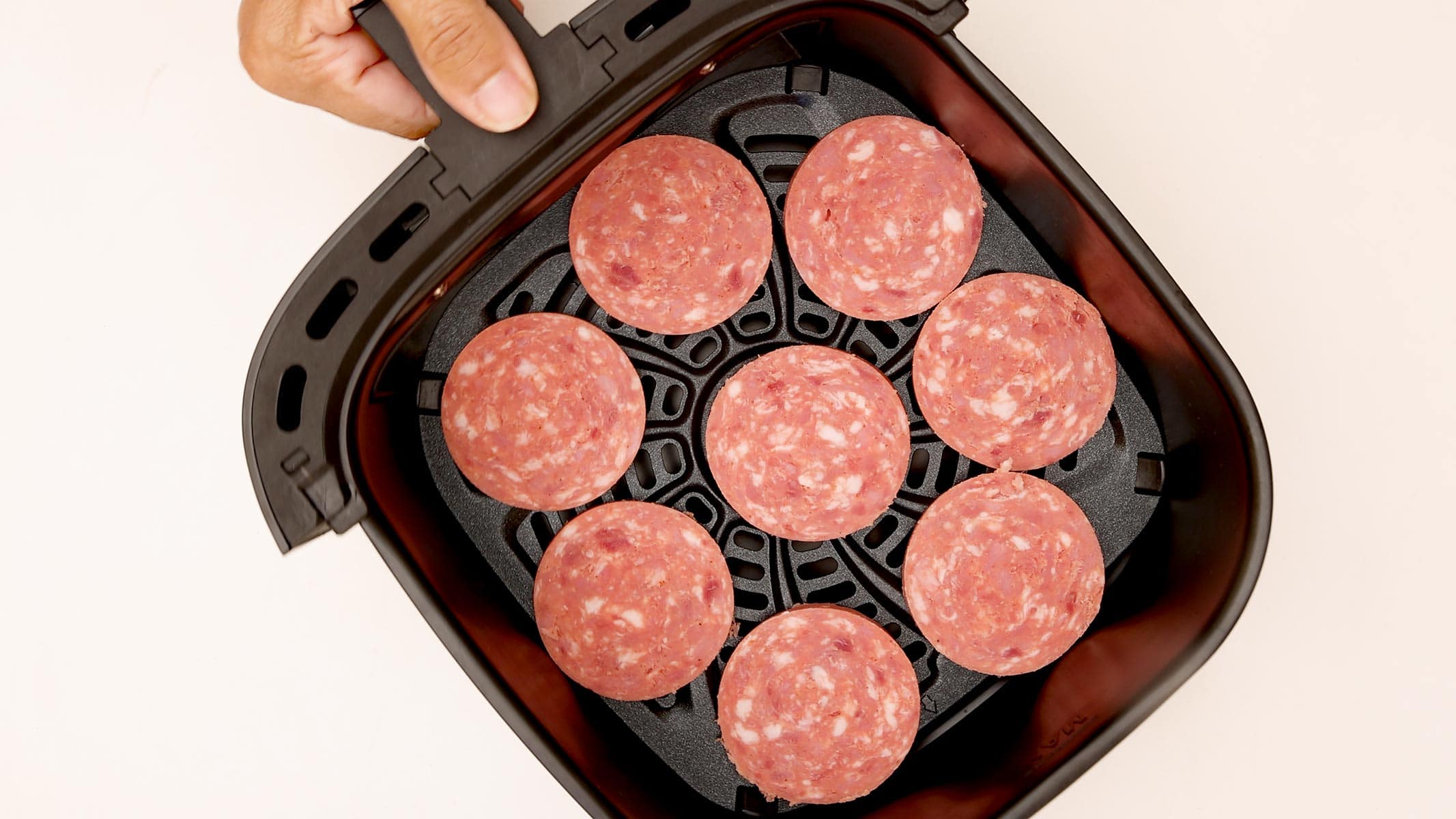 Air frying salami.