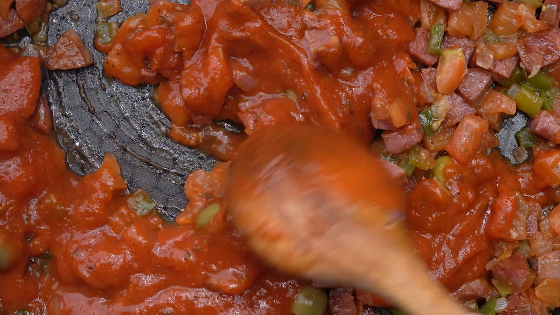 Stirring sauce in pan