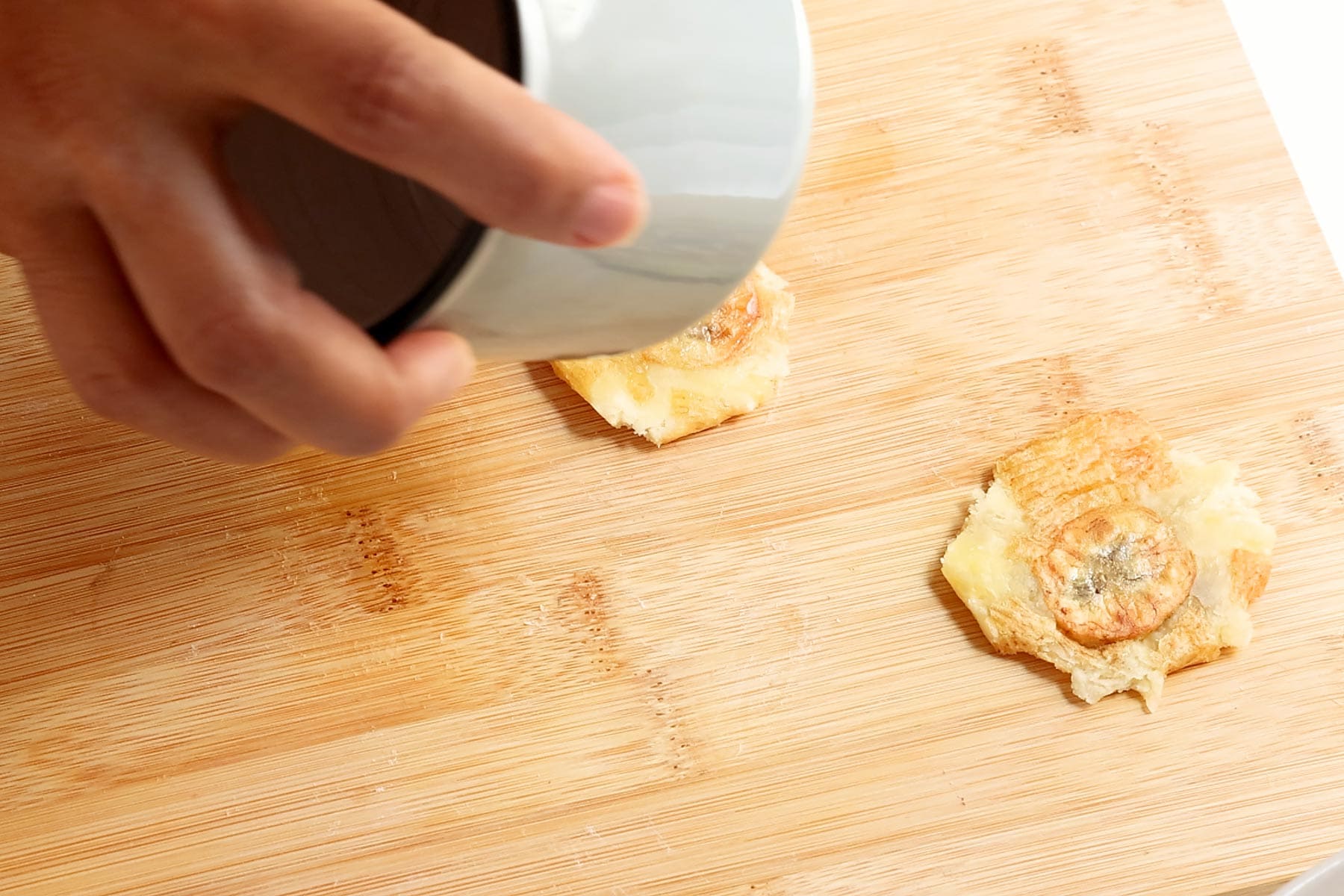 Flattening tostones.