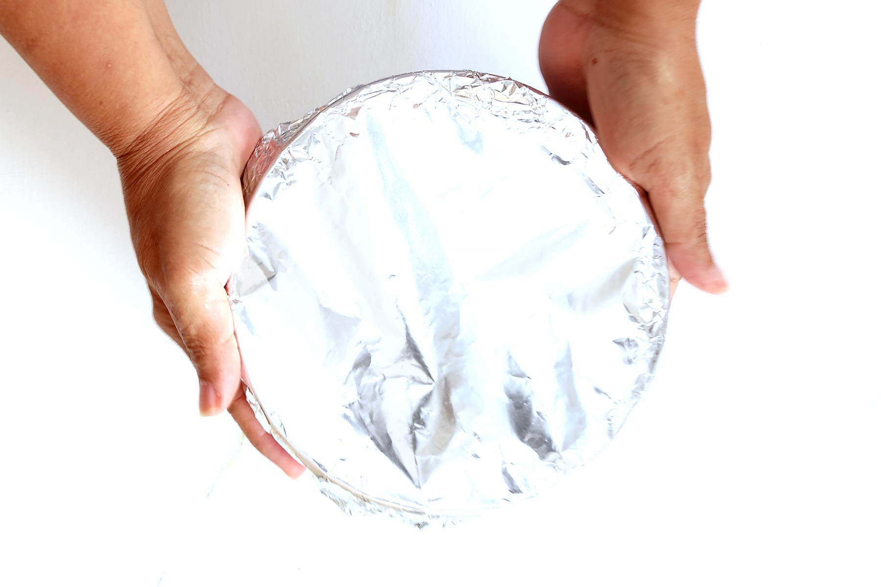 Wrapping ice cream cake for freezing.