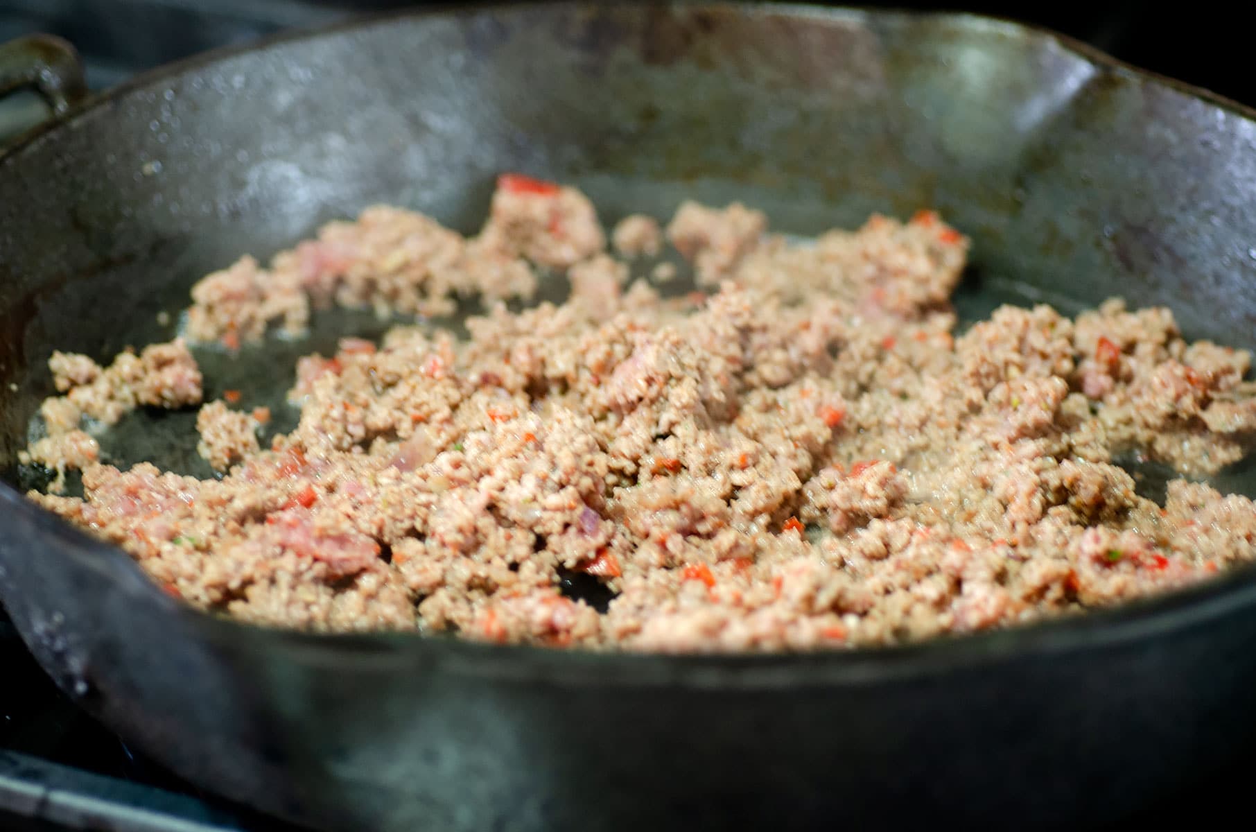 Browned meat in hot pan