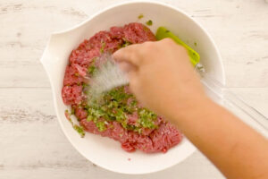 Adding salt to meat