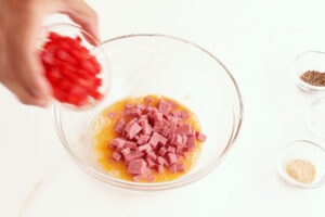 Mixing eggs.