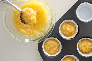 Pouring batter into cupcake molds