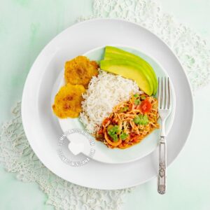 Repollo Guisado (Stewed Cabbage) served with rice and avocado