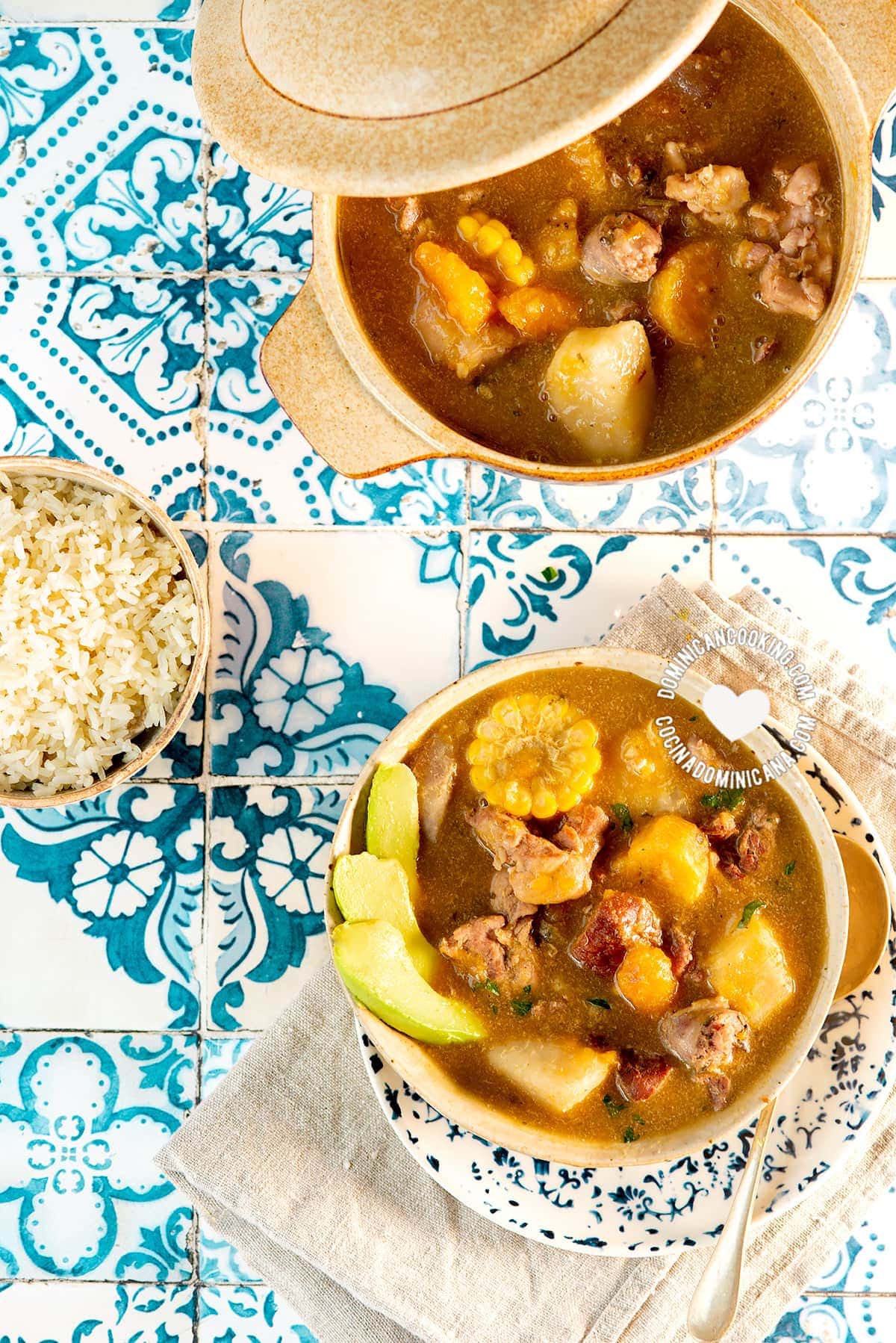 Sancocho de Siete Carnes (Seven Meat Stew) served with rice and avocado.