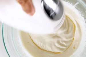 Preparing the whipped cream.