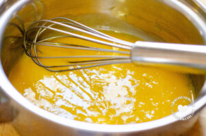 Mixing egg yolks.